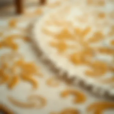 Close-up of intricate patterns on a cream and gold rug