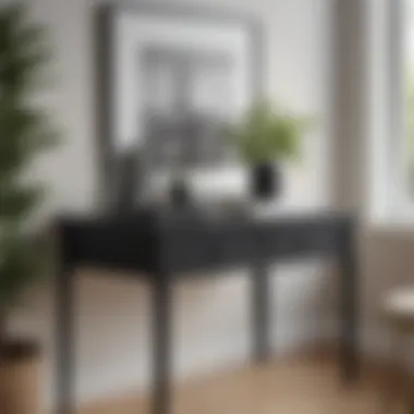 Small black table stand styled with decorative items on a minimalist desk Small black table stand styled with decorative items on a minimalist desk