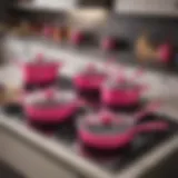 Vibrant hot pink cookware set displayed in a modern kitchen