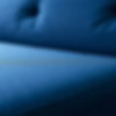 Close-up of navy blue fabric texture on a futon sofa bed