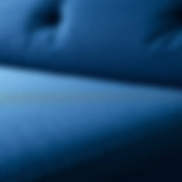 Close-up of navy blue fabric texture on a futon sofa bed