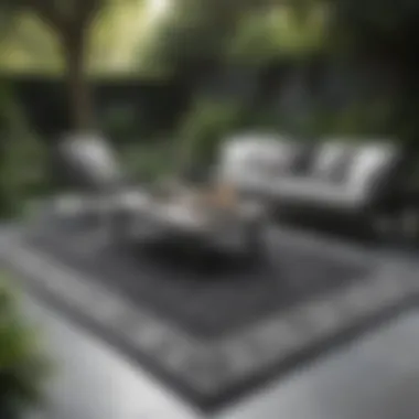 Black and grey outdoor rug in a lush garden environment